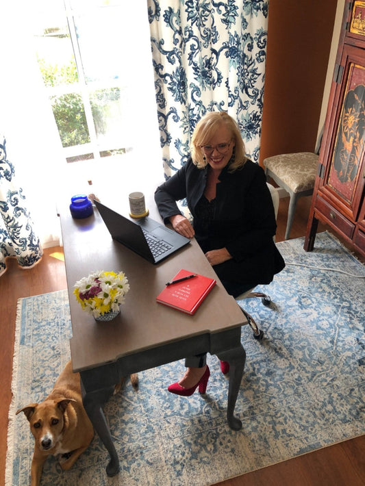 Patricia Skelton, decorative artist and founder of Open Window Restore, at her desk