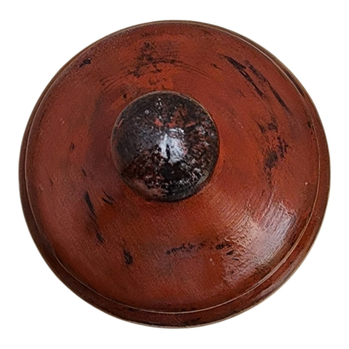 Top detail of solid wood decorative vessel with hand-applied red and black aged finish