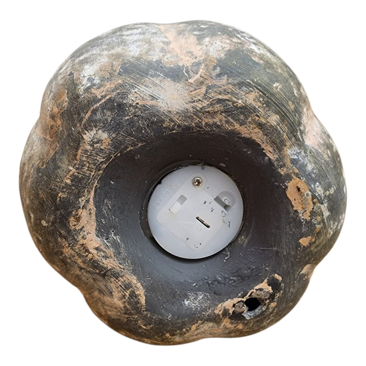 Battery compartment on bottom of small ceramic jack-o'-lantern