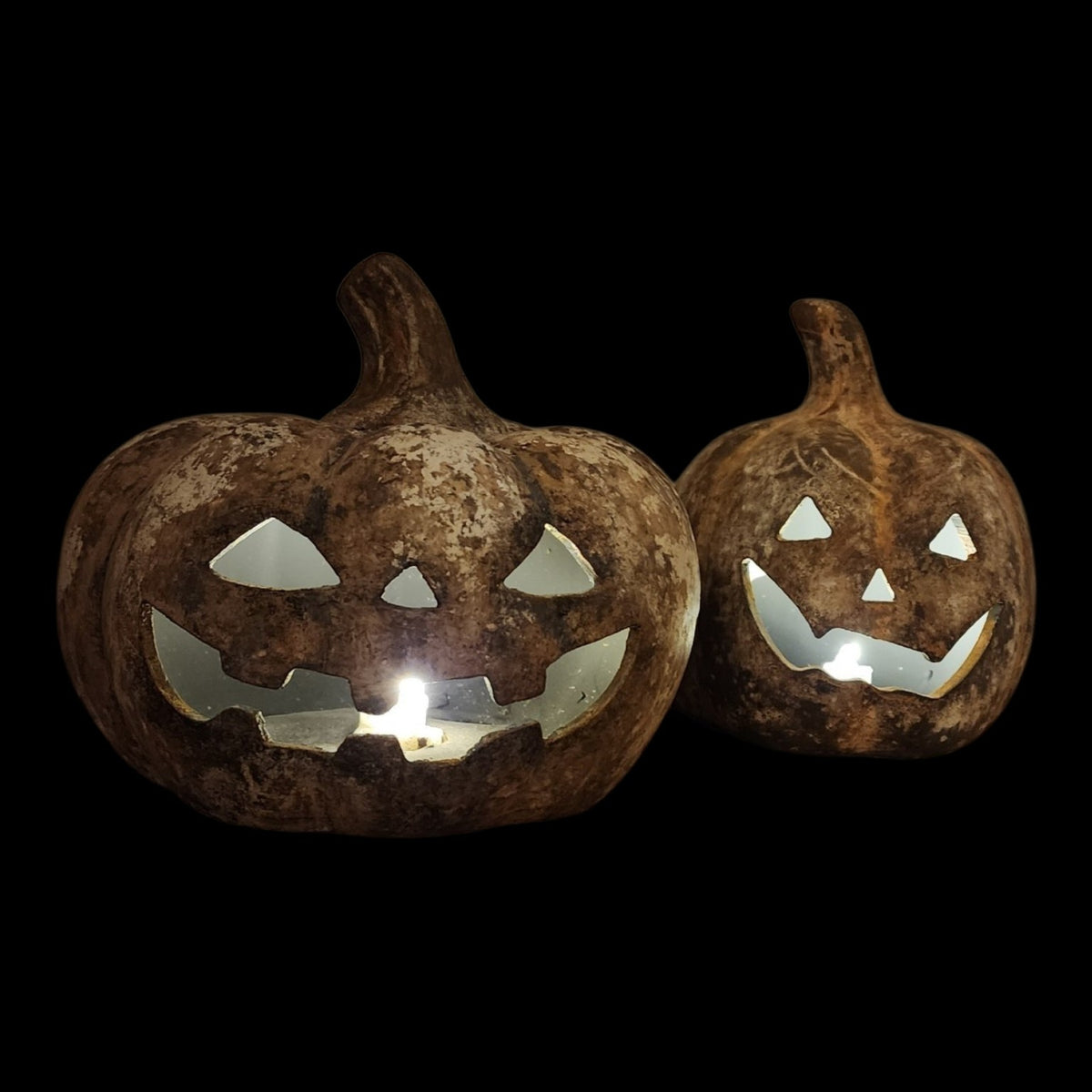 Hand-painted ceramic jack-o'-lantern illuminated by battery light