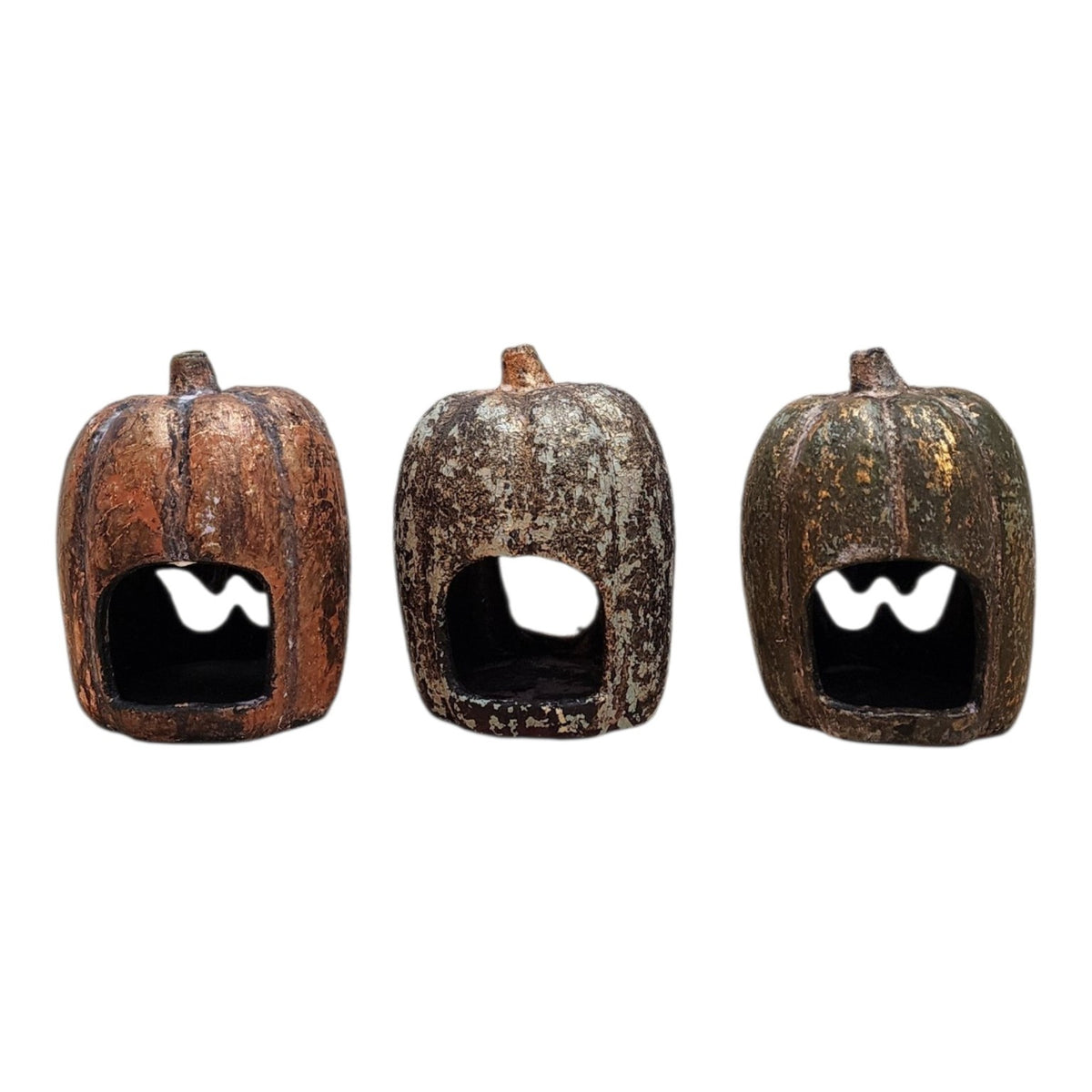 Side view of hand-finished ceramic pumpkin trio with layered aged patina