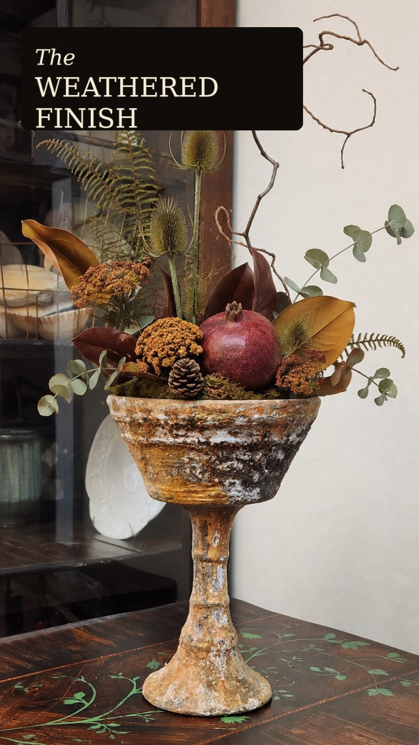 Weathered chalice urn styled with autumn florals